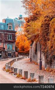 Streets of Montmartre in sunny autumn afternoon, golden trees and cobblestone alley. France. Paris. Autumn in France, old town. Streets of Montmartre in sunny autumn afternoon, golden trees and cobblestone alley. France. Paris. Autumn in France, old town.