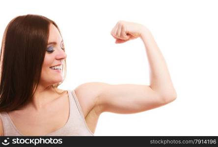 strength and power concept. Young woman showing her muscles on white