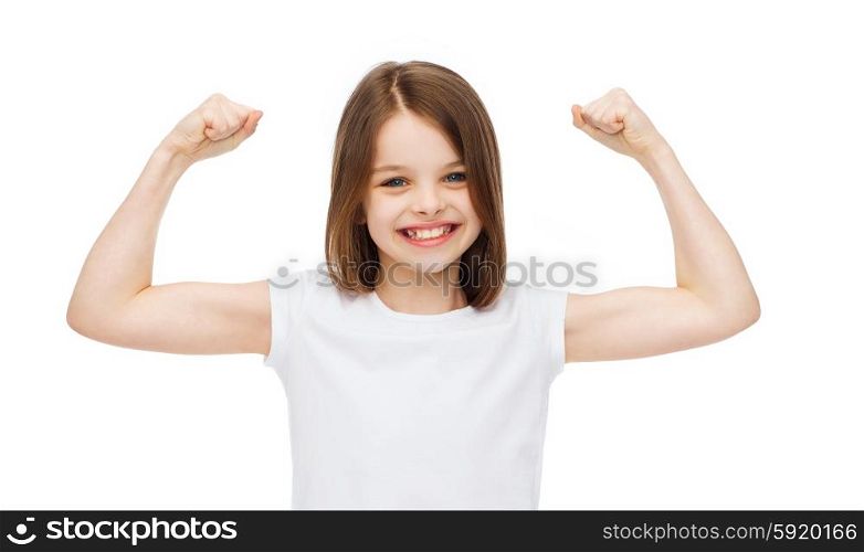 strength, health, sport, fitness concept - smiling teenage girl in blank white t-shirt showing muscles