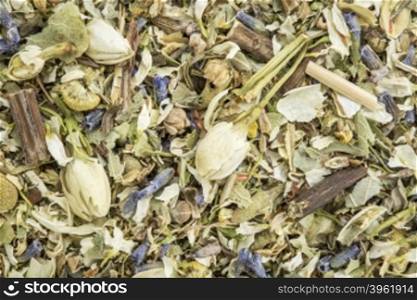 stress and anxiety herbal tea with lavender, chamomile, chrysanthemum, jasmine, lemon balm and Buddha tea - closeup background