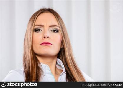 Stress and emotions in business. Professional woman in uniform work in office unhappy and nervous. Angry and irritated business woman in office.