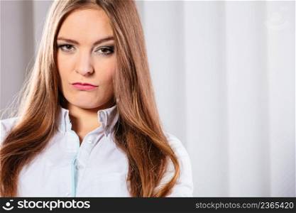 Stress and emotions in business. Professional woman in uniform work in office unhappy and nervous. Angry and irritated business woman in office.