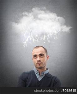Stress, depression and despair - gloomy storm cloud raining above a businessman head