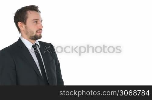 Stressed businessman adjusting his tie in anxiety and discomfit, side view on white with copyspace