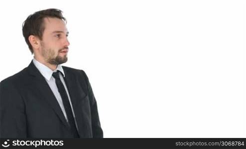 Stressed businessman adjusting his tie in anxiety and discomfit, side view on white with copyspace
