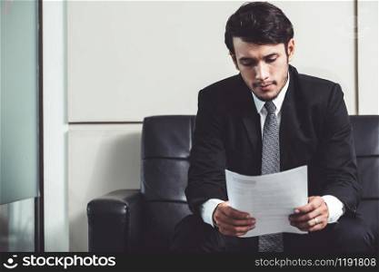 Stressed businessman candidate sit and wait for interview at the company office. Job application, business recruitment and Asian labor hiring concept.