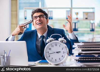 Stressed businessman thinking of suicide due to excessive workload. Stressed businessman thinking of suicide due to excessive worklo