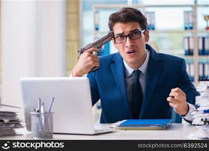 Stressed businessman thinking of suicide due to excessive workload. Stressed businessman thinking of suicide due to excessive worklo