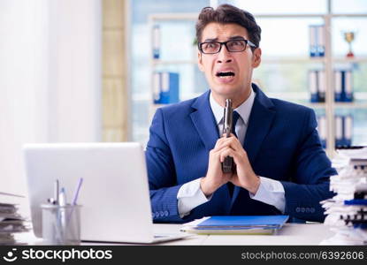 Stressed businessman thinking of suicide due to excessive workload. Stressed businessman thinking of suicide due to excessive worklo