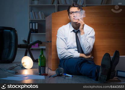 Stressed businessman working overtime in depression