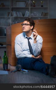 Stressed businessman working overtime in depression