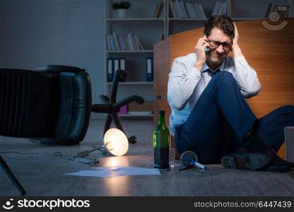 Stressed businessman working overtime in depression