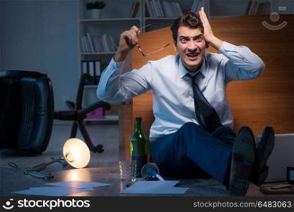 Stressed businessman working overtime in depression