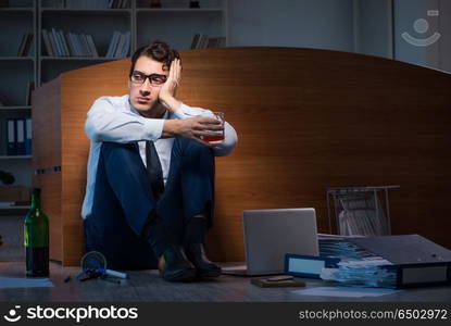 Stressed businessman working overtime in depression