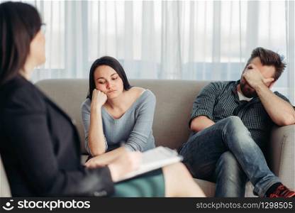 Stressed couple, patients at psychologist reception, civilized solution to the problem. Female doctor helps with consultation, family psychology support. Stressed couple patients at psychologist reception