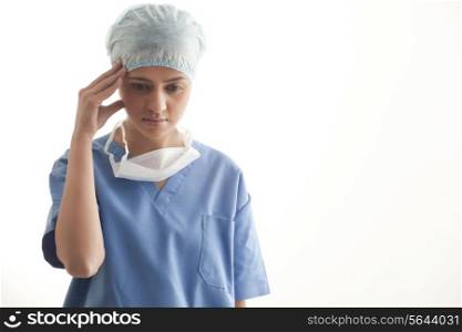 Stressed female doctor isolated over white background