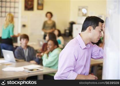 Stressed High School Teacher Trying To Control Class