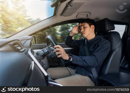 stressed man driver sitting inside a car