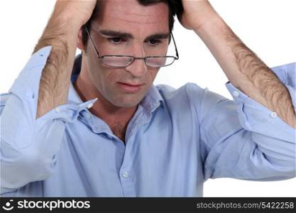 Stressed man wearing glasses