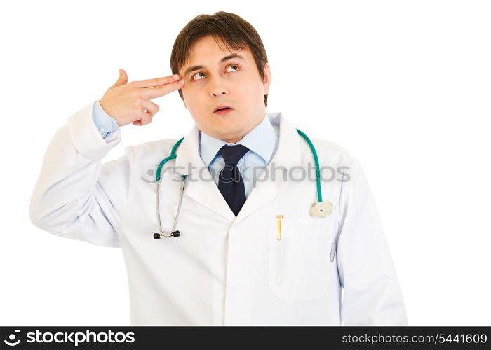 Stressed medical doctor with gun shaped hand isolated on white&#xA;