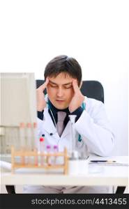 Stressed medical doctor working at office&#xA;