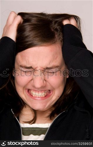 Stressed-out woman, holding head.
