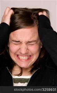 Stressed-out woman, holding head.