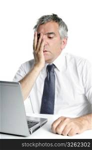 stressed senior businessman gesture working laptop computer white desk
