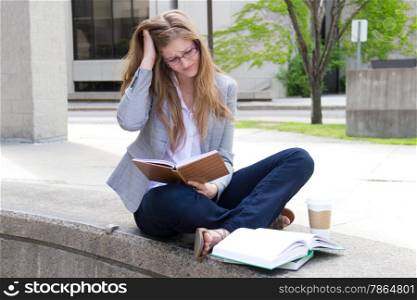 Stressed student studying on campus