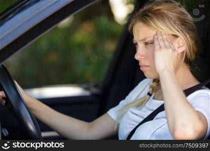 stressed woman driver sitting inside her car