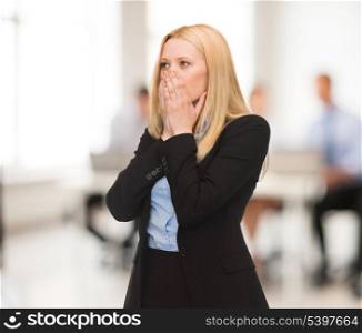 stressed woman holding her head with hand in office