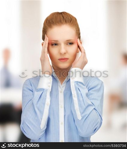 stressed woman holding her head with hands