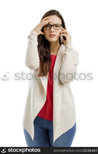 Stressed woman talking on the phone, isolated over white background