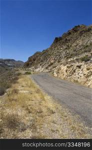 Stretch of bendy road in desert.