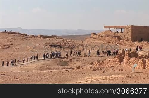 string of people in the fortress (Masada - ancient fortress at the south-western coast of the Dead Sea in Israel)