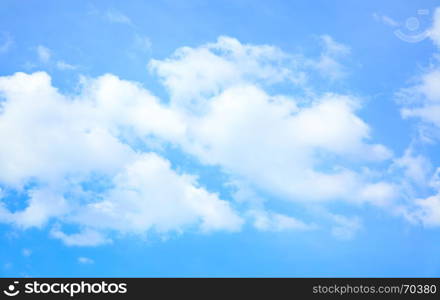 Strip of clouds in the blue sky, may be used as background