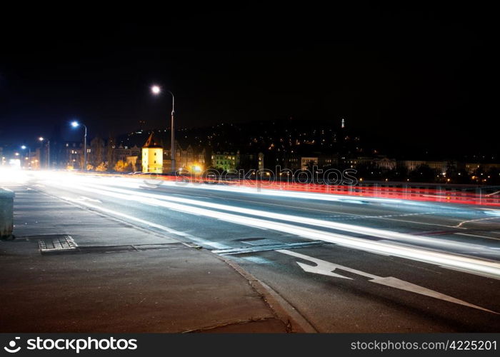 strip of passing cars on the street overnight