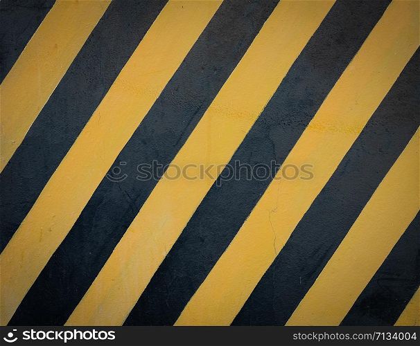 Striped black and yellow grunge background, warning signage.