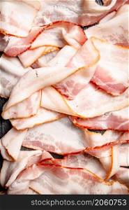 Strips of bacon. Macro background. Bacon texture. High quality photo. Strips of bacon. Macro background.