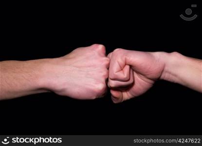 stroke by a fist in a fist on a black background
