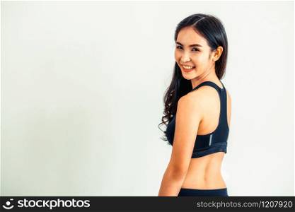 Strong and confident Asian woman in fitness gym. Healthy lifestyle concept.. Strong and confident Asian woman in fitness gym.