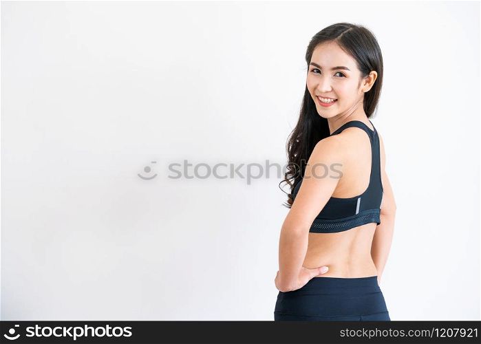 Strong and confident Asian woman in fitness gym. Healthy lifestyle concept.