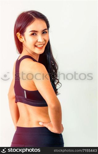 Strong and confident Asian woman in fitness gym. Healthy lifestyle concept.