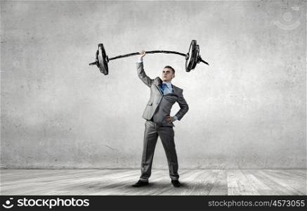 Strong and powerful. Confident businessman lifting above head sketched barbell