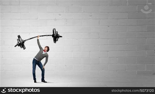 Strong and powerful. Confident man lifting above head sketched barbell