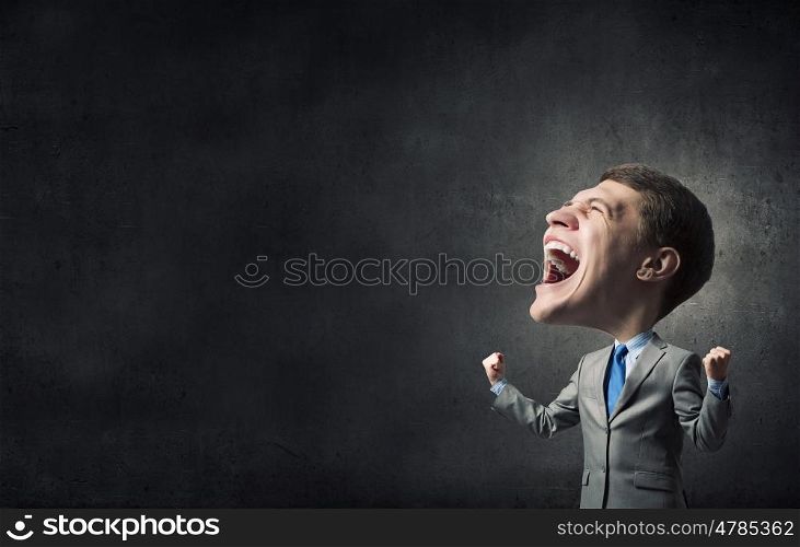 Strong and powerful. Young big headed businessman screaming with his hands up