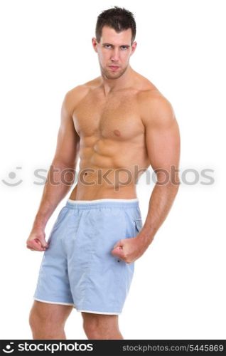 Strong athletic man showing muscles