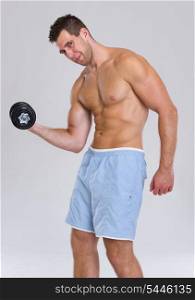 Strong athletic man workout biceps with dumbbell