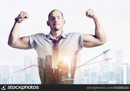 Strong businessman concept. Strong businessman double exposure concept. Business man showing muscular hands, mixed with sunset city skyline