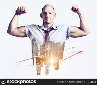 Strong businessman double exposure concept. Business man showing muscular hands, mixed with sunset city skyline